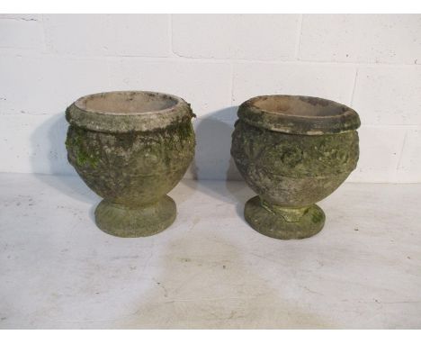 A pair of concrete garden urns - one repaired, height 39cm