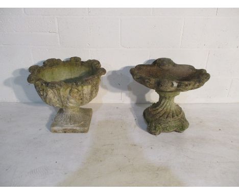 A concrete garden birdbath, along with a garden urn 