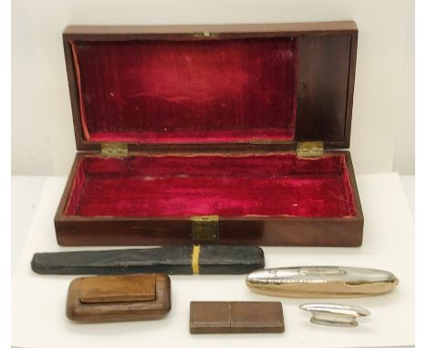 A velvet lined mahogany case containing a snuff box, tortoiseshell blades in leather case and a hallmarked silver nail buffer