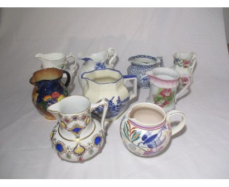 A collection of various jugs including Poole, Royal Doulton, Aynsley etc