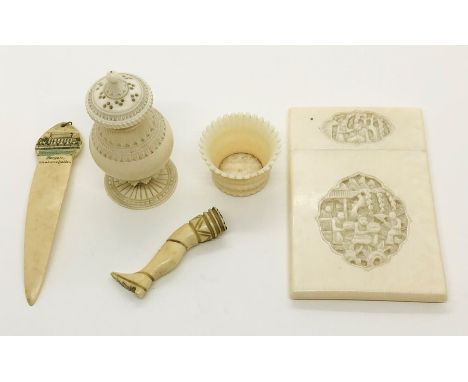 A late 19th century ivory card case, pepperette (A/F) and pipe tamper in the form of a leg (A/F) etc.