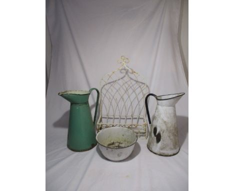 Two enamelled jugs along with a wrought iron hanging shelf etc.