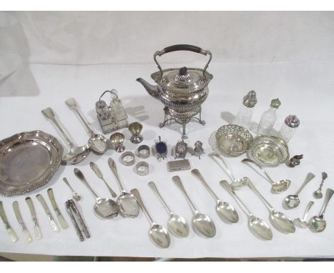 A collection of various silver plated items including spirit kettle on stand, napkin rings, spoons, ladles etc