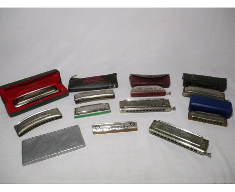 A collection of nine harmonicas including, Hohner Cromonica, Hohner Chromatic Harmonica, Hohner Chromatic Bandmaster, Hohner 