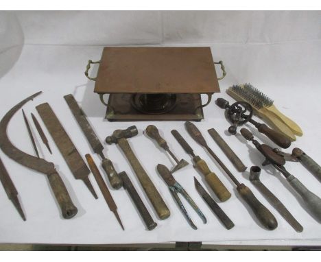 A small collection of tools including files, hammer, wire brushes etc, along with a copper plate warmer