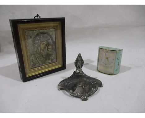 An unusual Keinzle 7 Rubis travel alarm clock with patterned bird decoration along with a modern Russian icon and one other.