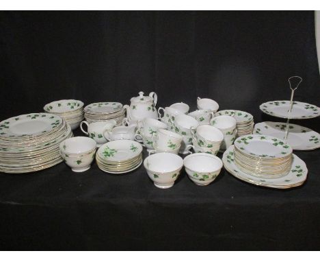 A comprehensive part Colclough ivy leaf and similar dinner set including tea cups, saucers, plates, tea pot, sugar bowls, cak
