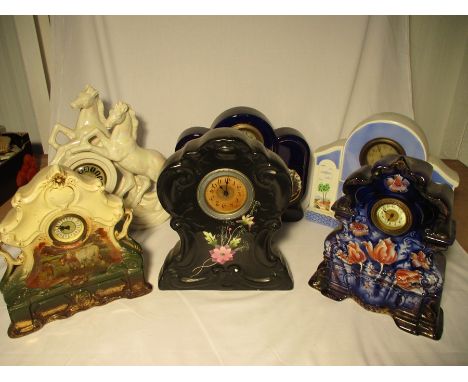 A collection of vintage ceramic clocks