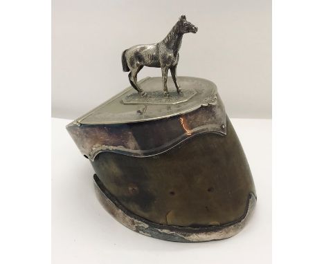 A silver plated snuff box formed from a horses hoof