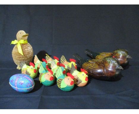 Two wooden trinket boxes in the form of ducks along with a collection of Easter chicken decorations etc.