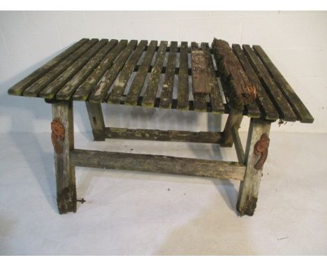 A wooden garden table with cast iron lifting handles - table A/F