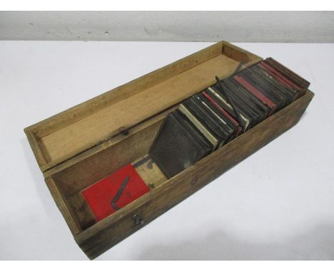 A collection of magic lantern slides in wooden case