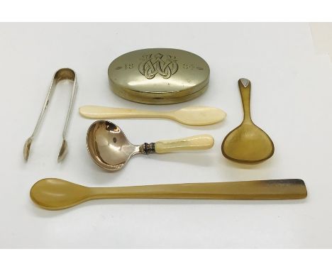 A pair of hallmarked silver sugar tongs, an SCM snuff box dated 1884, horn spoons etc