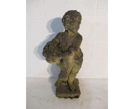 A concrete garden statue of a boy carrying a basket - height 75cm
