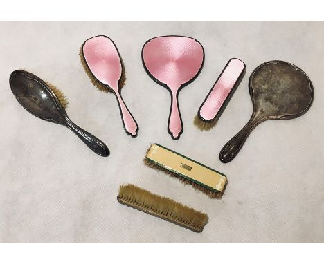  A pink guilloche enamel hallmarked silver part dressing set consisting of a mirror and two brushes, along with a hallmarked 