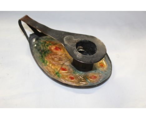 A pair of early 20th century Art Nouveau brown patinated copper and enamelled oval chamber sticks,  the pan area embossed and