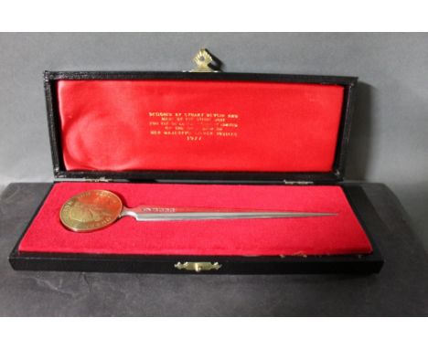 an Elizabeth II silver paper knife, designed by Stuart Devlin and made by The Royal Mint for the De la Rue Company Limited, m