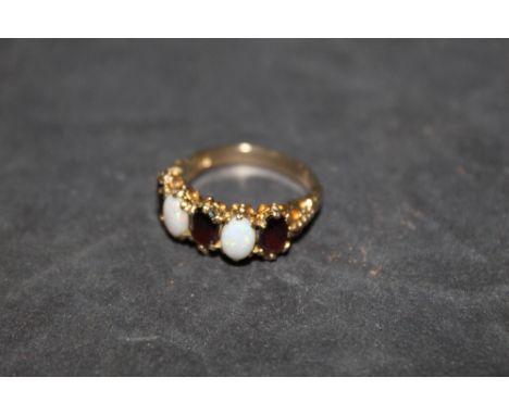 A 9 ct gold opal and garnet five stone ring, of Victorian design, Size K/L with a gross weight 4 grams. CONDITION REPORT: som