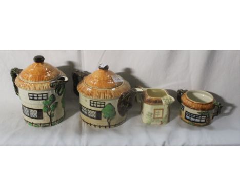 A matched four piece cottage ware tea set, together with three Japanese cottage ware style condiments. CONDITION REPORT: Some