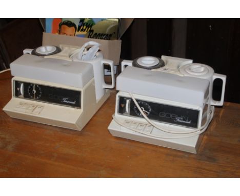Two vintage teasmade's CONDITION REPORT: Yellowing to the plastic parts, one light cover cracked, one pot missing its cover. 