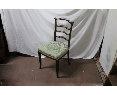 A Edwardian mahogany ladder back bedroom chair, with butterfly moulding. 89 cm high with a seat height of 45 cm. CONDITION RE