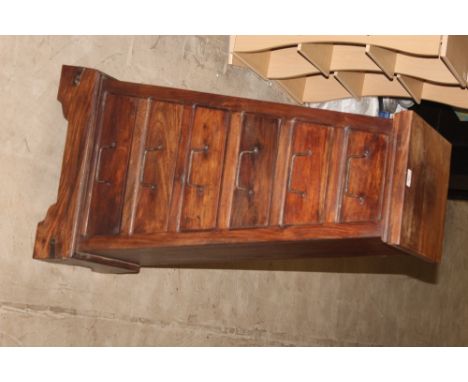 A modern hardwood chest of drawers with angled sides fitted six drawers on bracket feet, 48 cm wide x 33 cm deep x 96 cm high