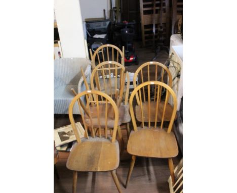 A set of four Ercol light elm chairs and three similar with dished seats.