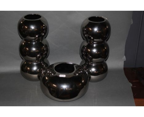 A pair of silvered ceramic bobbin style vases, 31 cm high, a pair of similar ditto circular bowls, each 21 cm diameter and a 