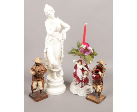 A plaster cast Nao classical figurine, along with a continental figural candlestick, pair of papier mache figures.