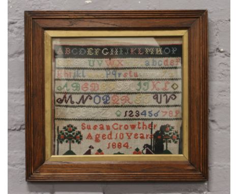 A framed Victorian sampler Susan Crowther aged 10 years 1884.