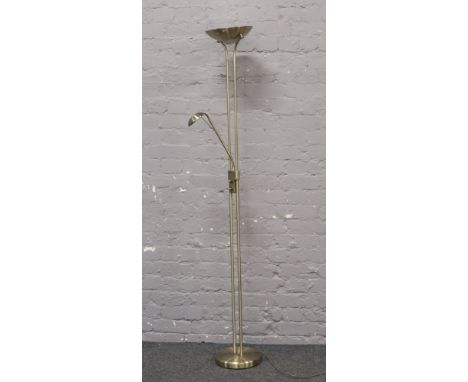 A brushed brass effect standard lamp with uplight and adjustable reading lamp.