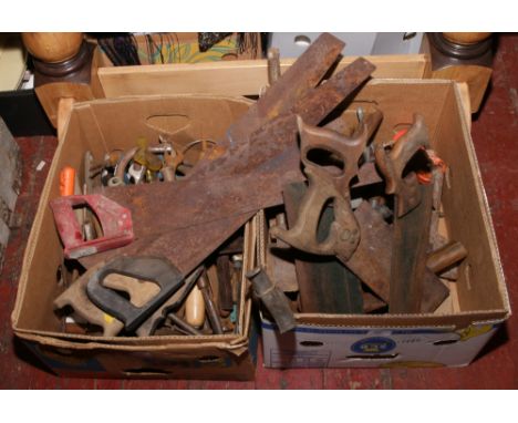 Two boxes of hand tools including hand saws, wood turning chisels, spanners, hammers, drivers etc.
