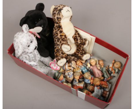 A collection of studio Hummel ceramic Christmas ornaments (some damaged) along with three TY Beanie Babies.