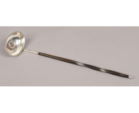A Georgian silver toddy ladle with coin base, assayed London 1809.