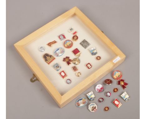 A collection case and loose quantity of mainly enamel pin badges for Russia and the USSR in Lenin.