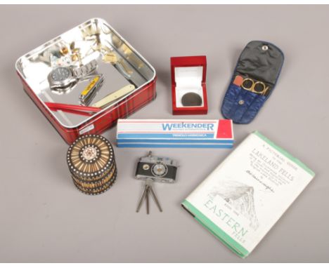 A tin of collectables to include porcupine quill trinket box, camera lighter / compass, George III wheel penny 1797, precisio