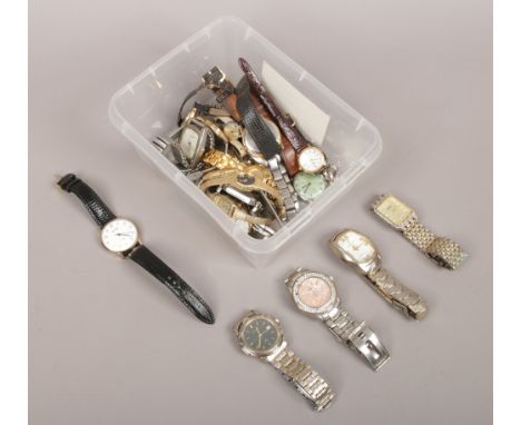 A box of ladies and gents wristwatches to include quartz and manual examples.