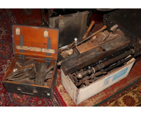 An ammunition crate, wooden crate and box of various metalwares including hand tools, vintage pumps, moulding planes etc.