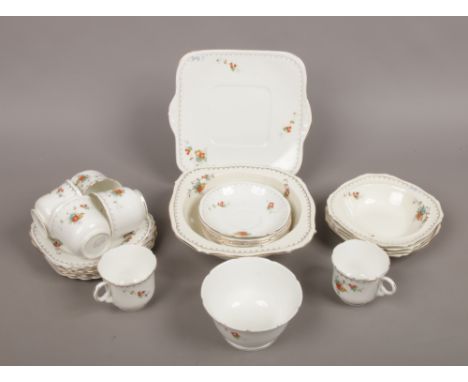 An Art Deco Alfred Meakin bone china part tea service including sandwich plate, cups, saucers, slop bowl etc.