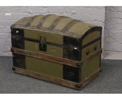 A late 19th / early 20th century metal and wood bound dome top trunk with decoupage decoration to the interior.Condition repo