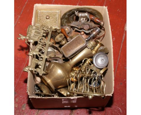 A box of metalwares to include brass tea caddy, toast rack, door knocker, vases, novelty jugs etc.