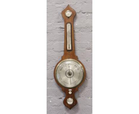 An Edwardian Mercury filled banjo barometer C1870. with silvered dial, thermometer and level bubble.