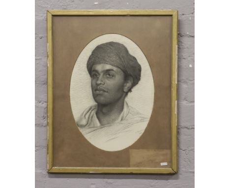 A gilt framed pencil drawing portrait of a middle eastern boy, signed S. Townson 1881.Condition report intended as a guide on