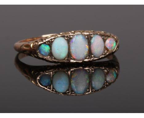 An early 20th century five stone opal ring. Size S.