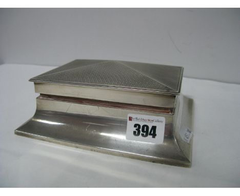 A Hallmarked Silver Cigarette Box, of tapering design with engine turned hinged lid, base 16.3 cms wide.  