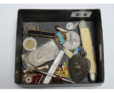 A Mother of Pearl Handled Fruit Knife, penknife, badges, including 'Sylvester', coins, clip etc. 