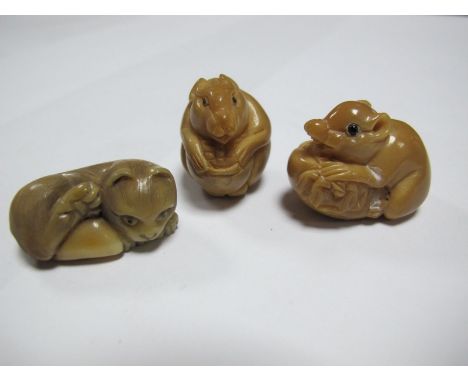 An Early XX Century Japanese Hardstone Netsuke, carved into a door mouse holding a nut, 3cm high, and two others, one carved 