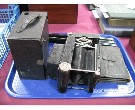 A C.D.V Tenax C.P Goerz Berlin Folding Camera, camera plates, tripod a vest pocket Kodak and a JB Ensign box camera:- One Tra