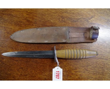 A commando style dagger and leather sheath. 