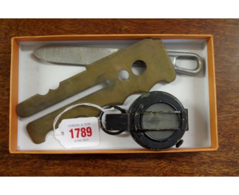 A World War II period compass;&nbsp;together with a brass button polisher; and an unusual 1944 US LF&amp;C knife. 